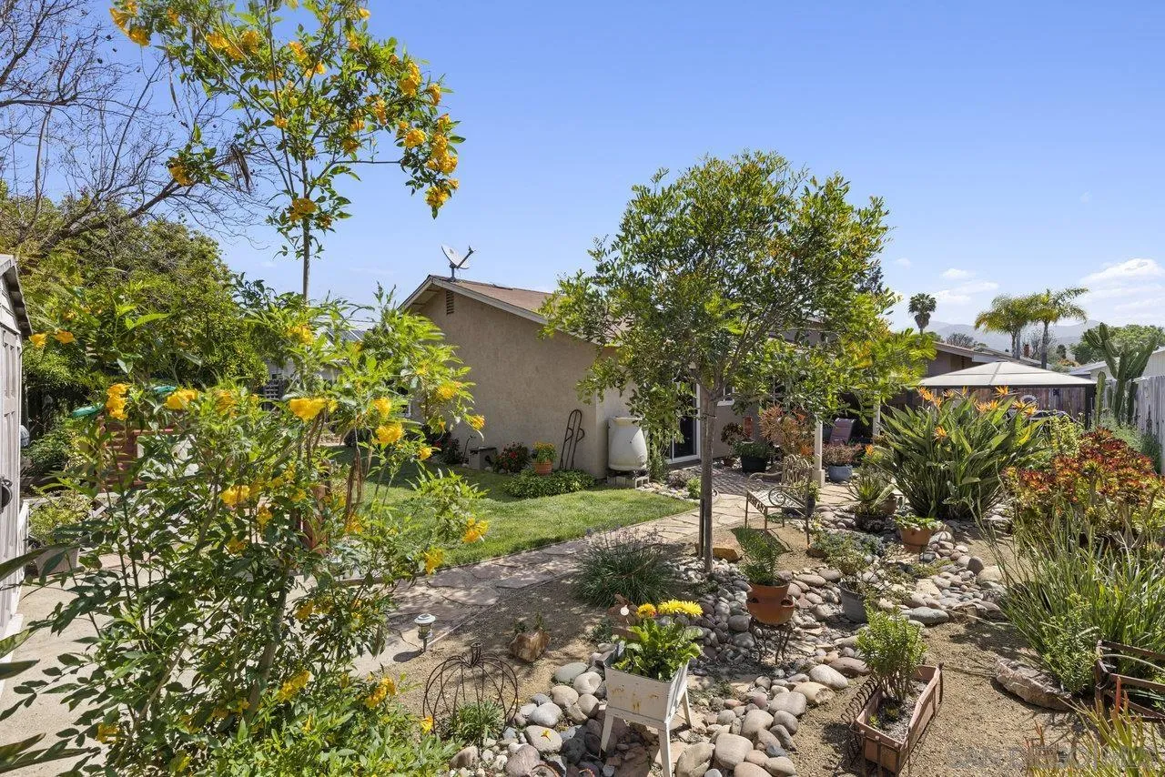 13344 Racquet Court Poway, CA 92064 - Photo 29 of 29 a view of a garden with plants and a bench