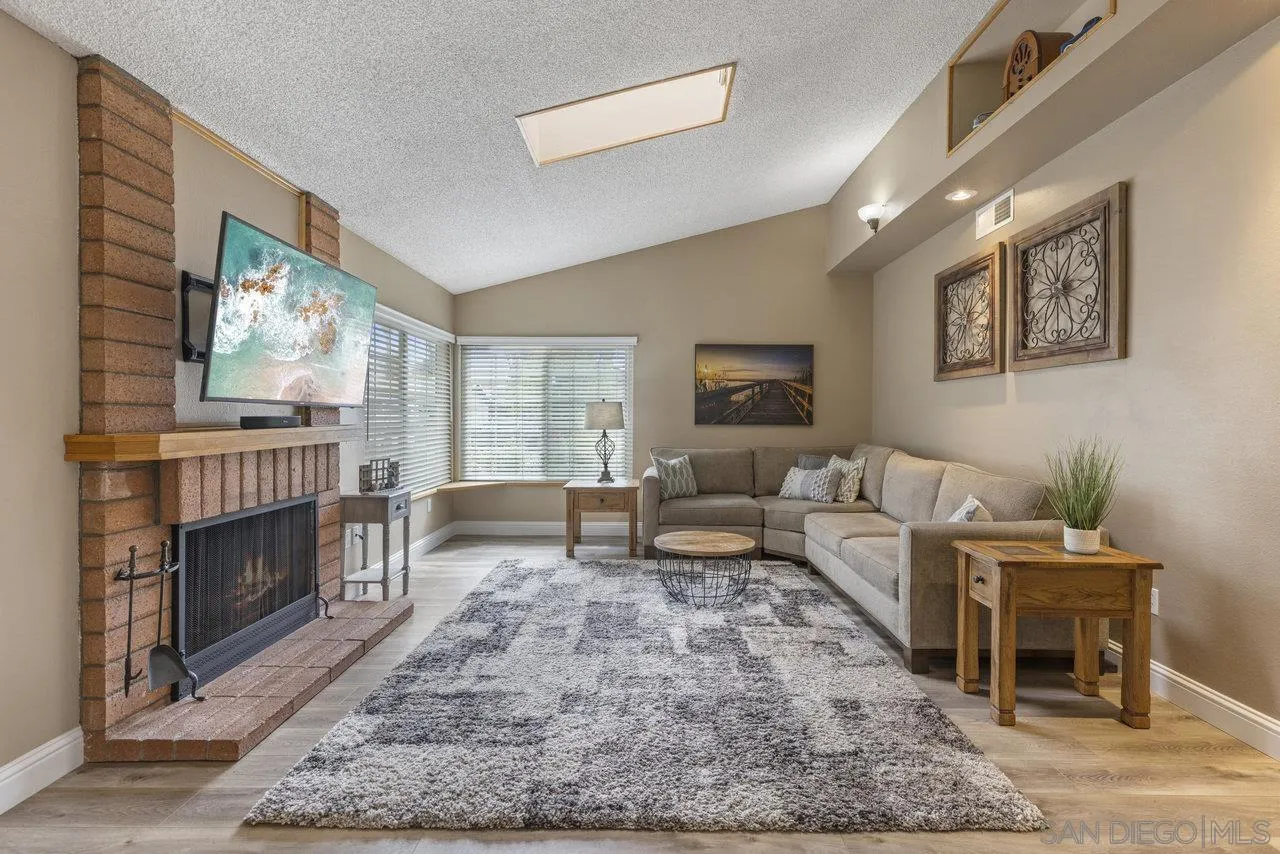 13344 Racquet Court Poway, CA 92064 - Photo 3 of 29 a living room with furniture and a fireplace