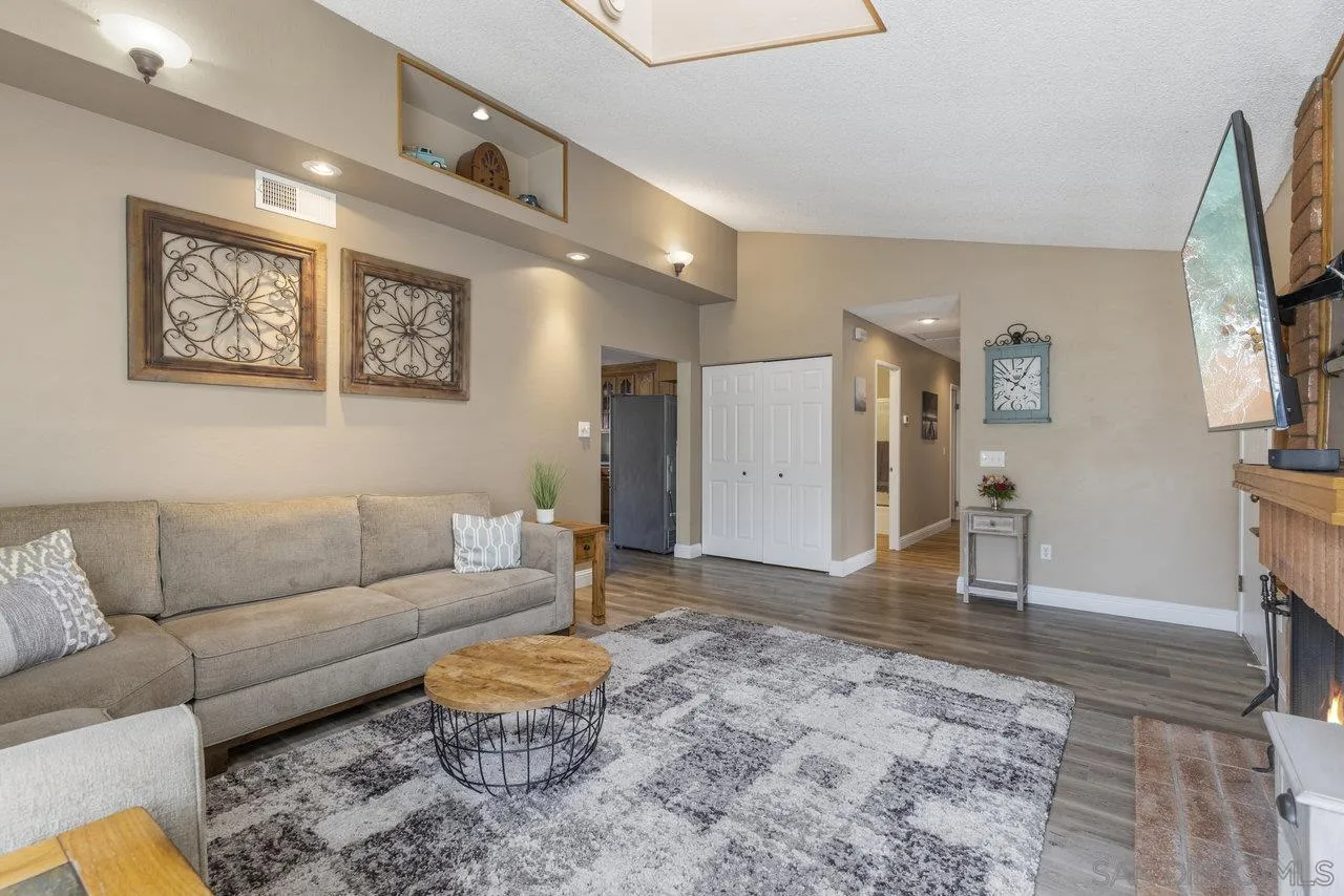 13344 Racquet Court Poway, CA 92064 - Photo 5 of 29 a living room with furniture and a flat screen tv