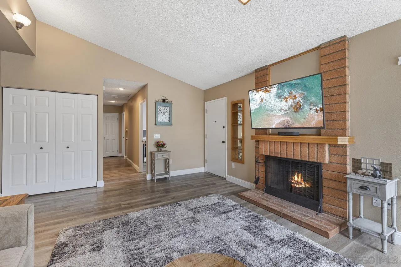 13344 Racquet Court Poway, CA 92064 - Photo 6 of 29 a living room with furniture and a fireplace