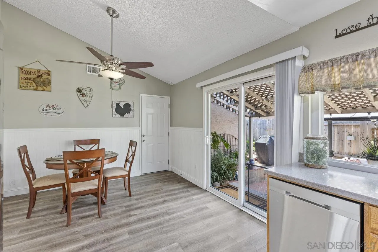 13344 Racquet Court Poway, CA 92064 - Photo 10 of 29 a view of a dining room with furniture window and wooden floor