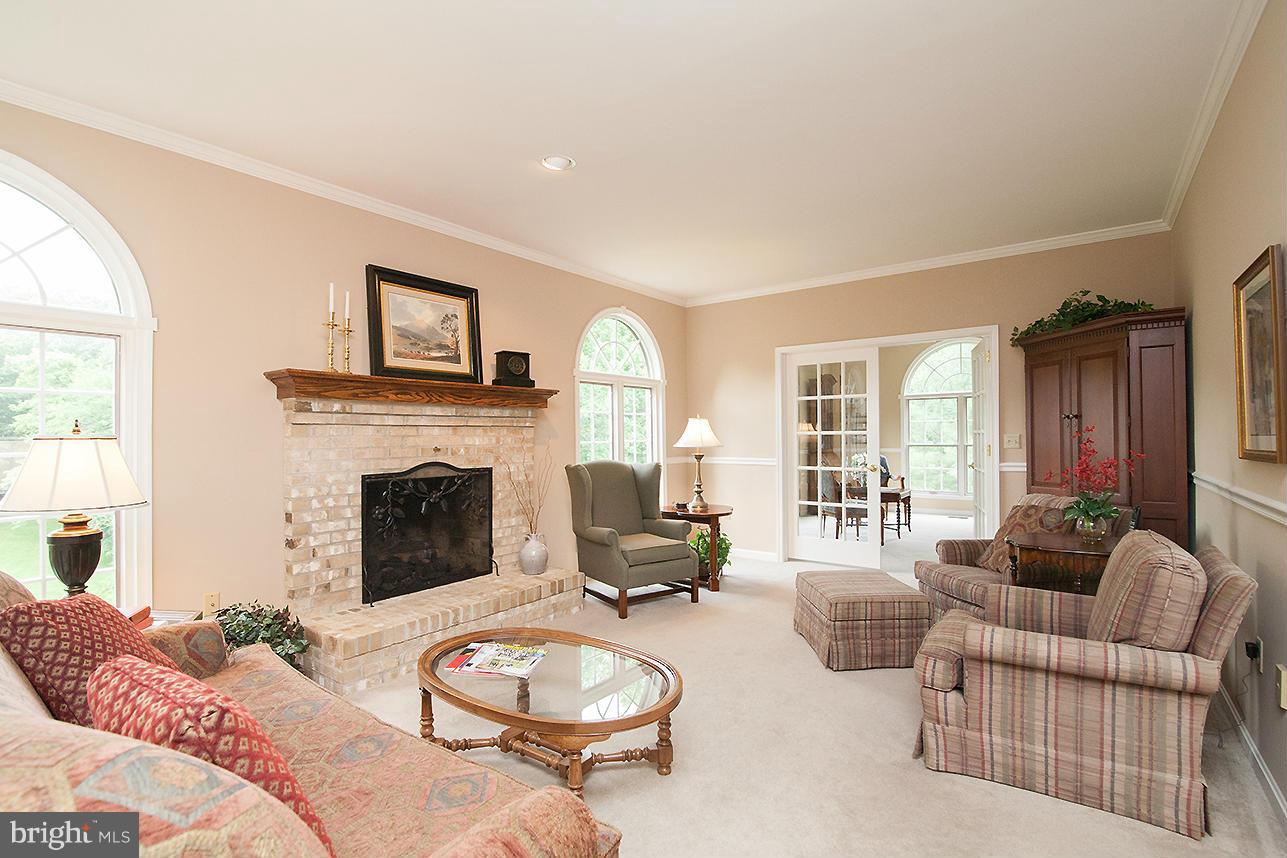 8842 Indian Springs Road Frederick, MD 21702 - Photo 9 of 30 great room with fireplace open to kitchen