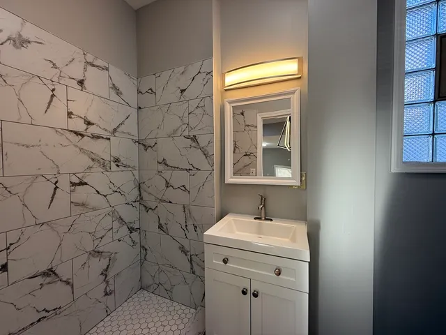 a bathroom with a sink and vanity