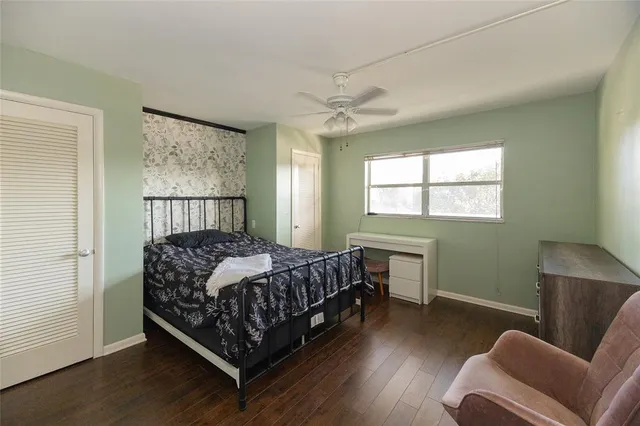 a bedroom with a bed window and couch