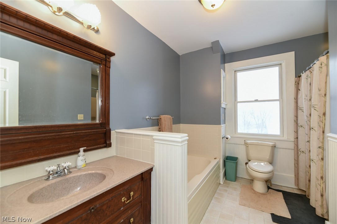 6849 Waterloo Road Atwater, OH 44201 - Photo 24 of 35 Here is the antique vanity and mirror keeping true to the charachter of this beautiful home. Stand-up shower is to the right of the commode.