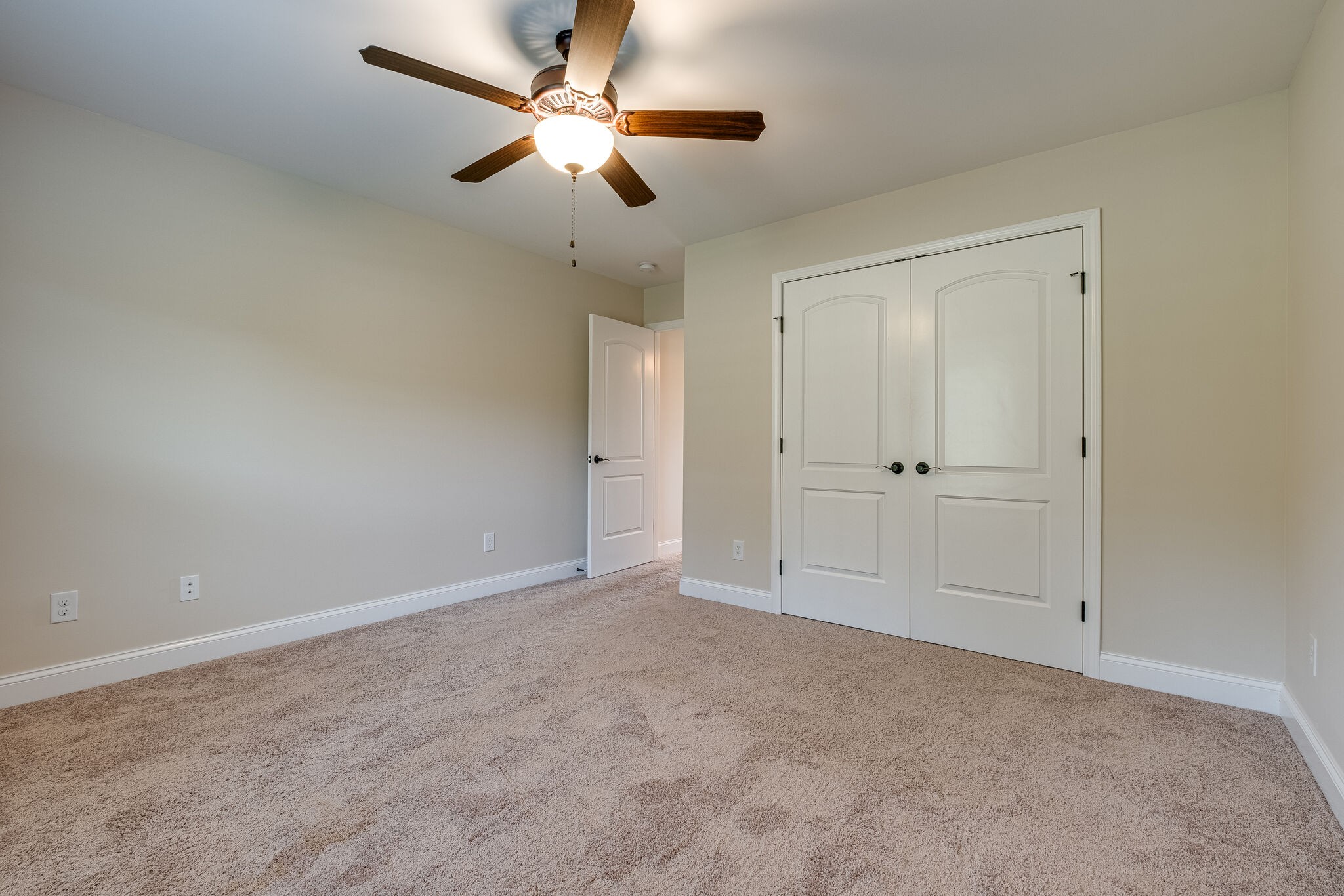 315 Abbey Road Lebanon, TN 37090 - Photo 26 of 35 an empty room with closet and a chandelier fan