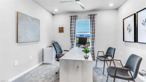 a view of a workspace with furniture