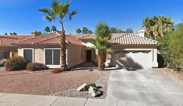 a view of a house with a yard