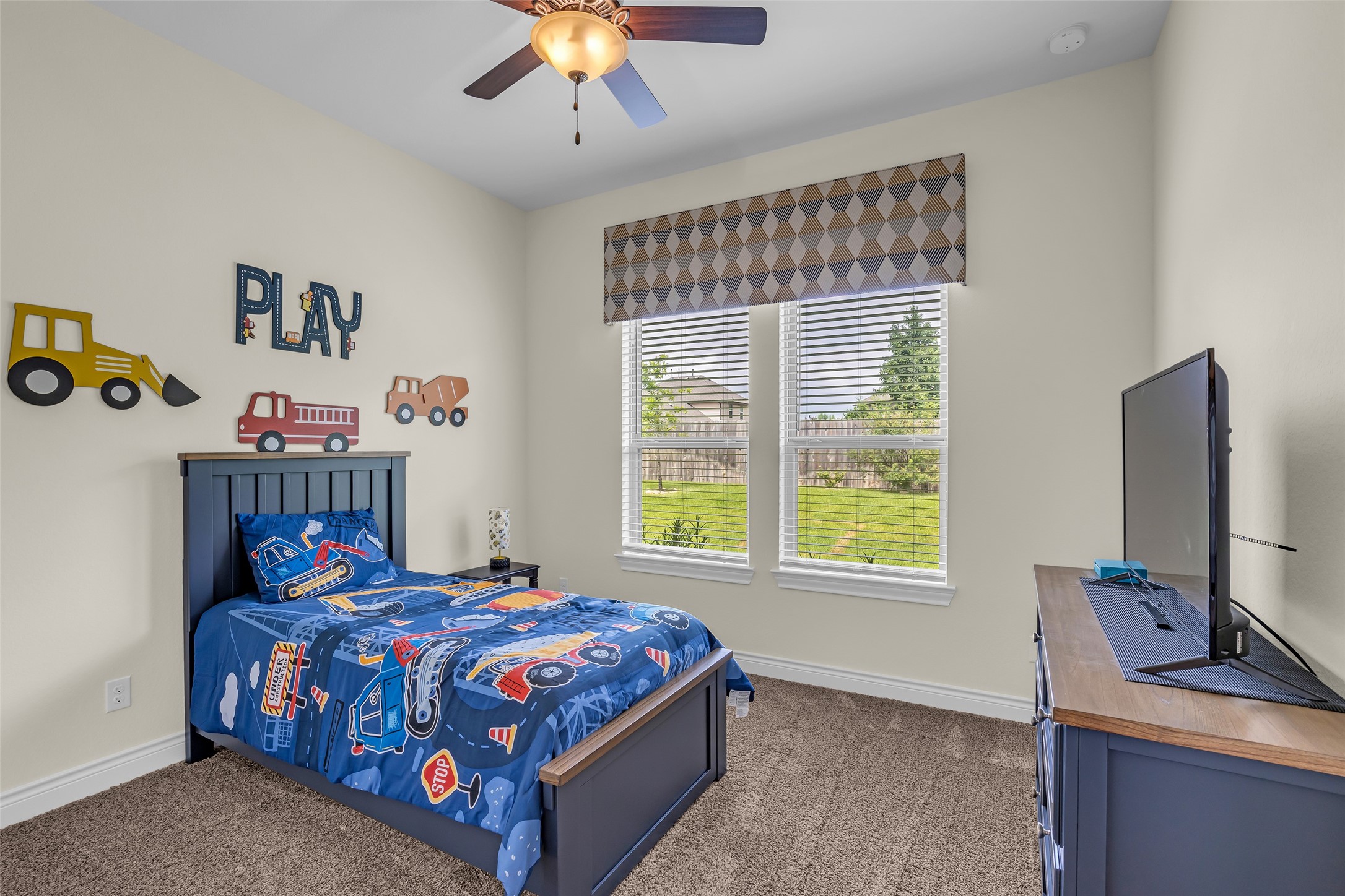 14003 South Evergreen Ridge Court Conroe, TX 77384 - Photo 27 of 43 One of two secondary bedrooms tucked into their own private wing at the back of the home.