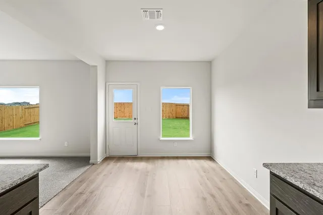 an empty room with windows