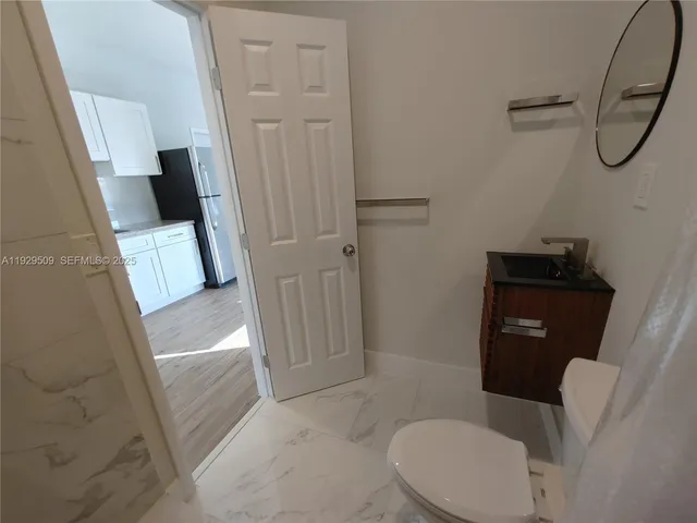 a bathroom with a sink and toilet