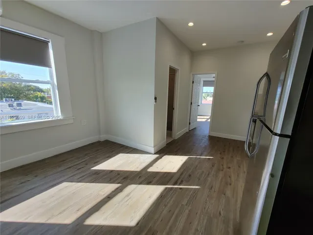 a view of wooden floor in an empty room