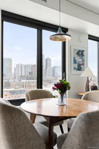 a bed sitting in a bedroom and table