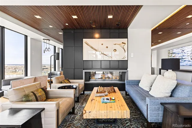 a view of swimming pool with outdoor seating and city view