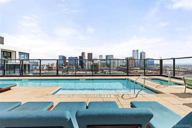 a view of a swimming pool with a lounge chair