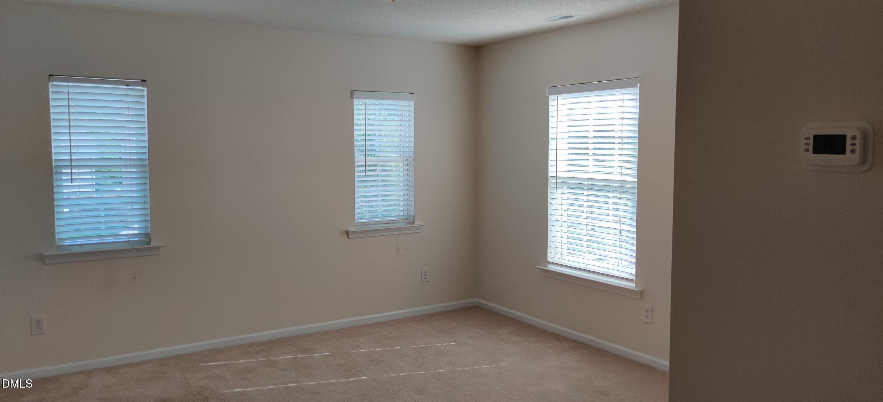 4011 Oatgrass Lane Raleigh, NC 27604 - Photo 17 of 21 a view of an empty room with a window
