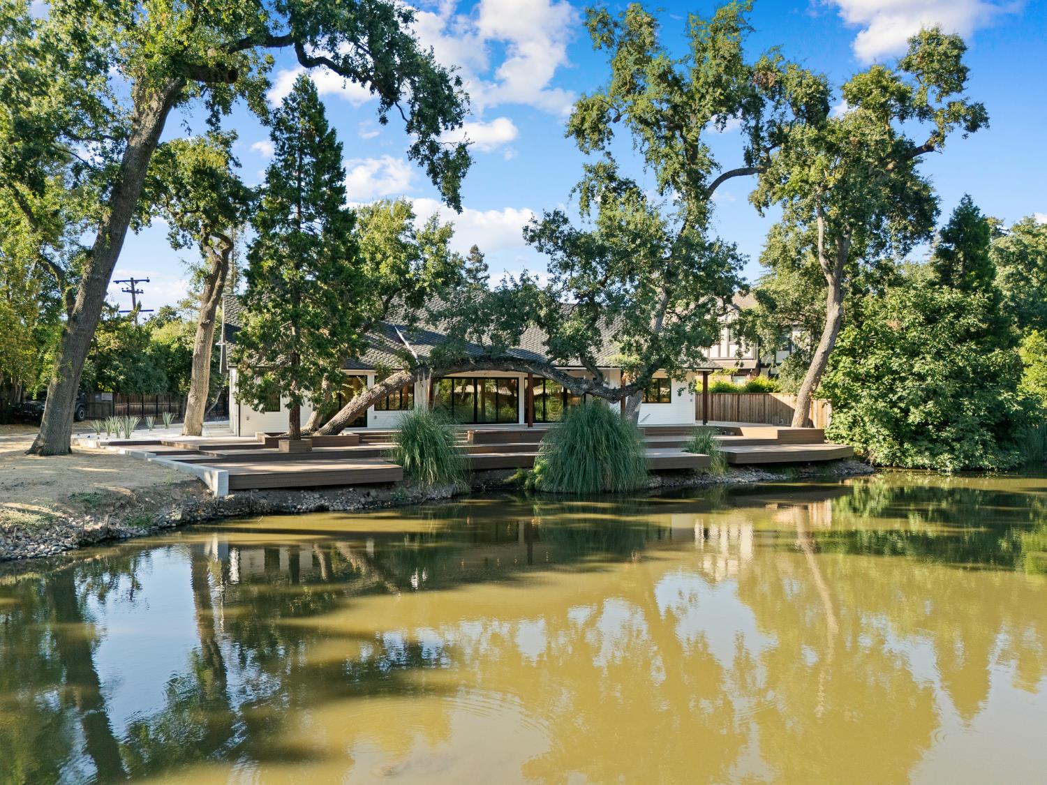 a view of swimming pool with trees in the background
