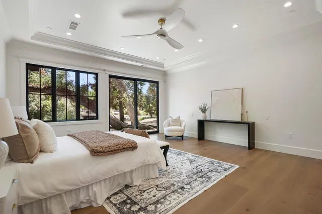 a bedroom with a bed and a potted plant