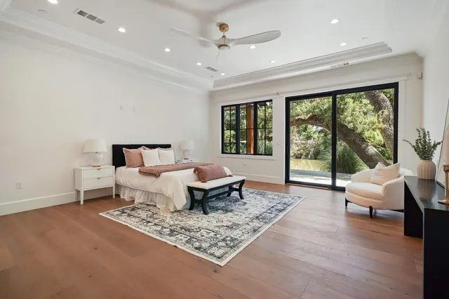 a spacious bathroom with a double vanity sink mirror and bathtub
