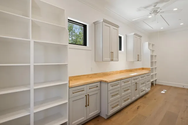 a lobby with furniture and large windows