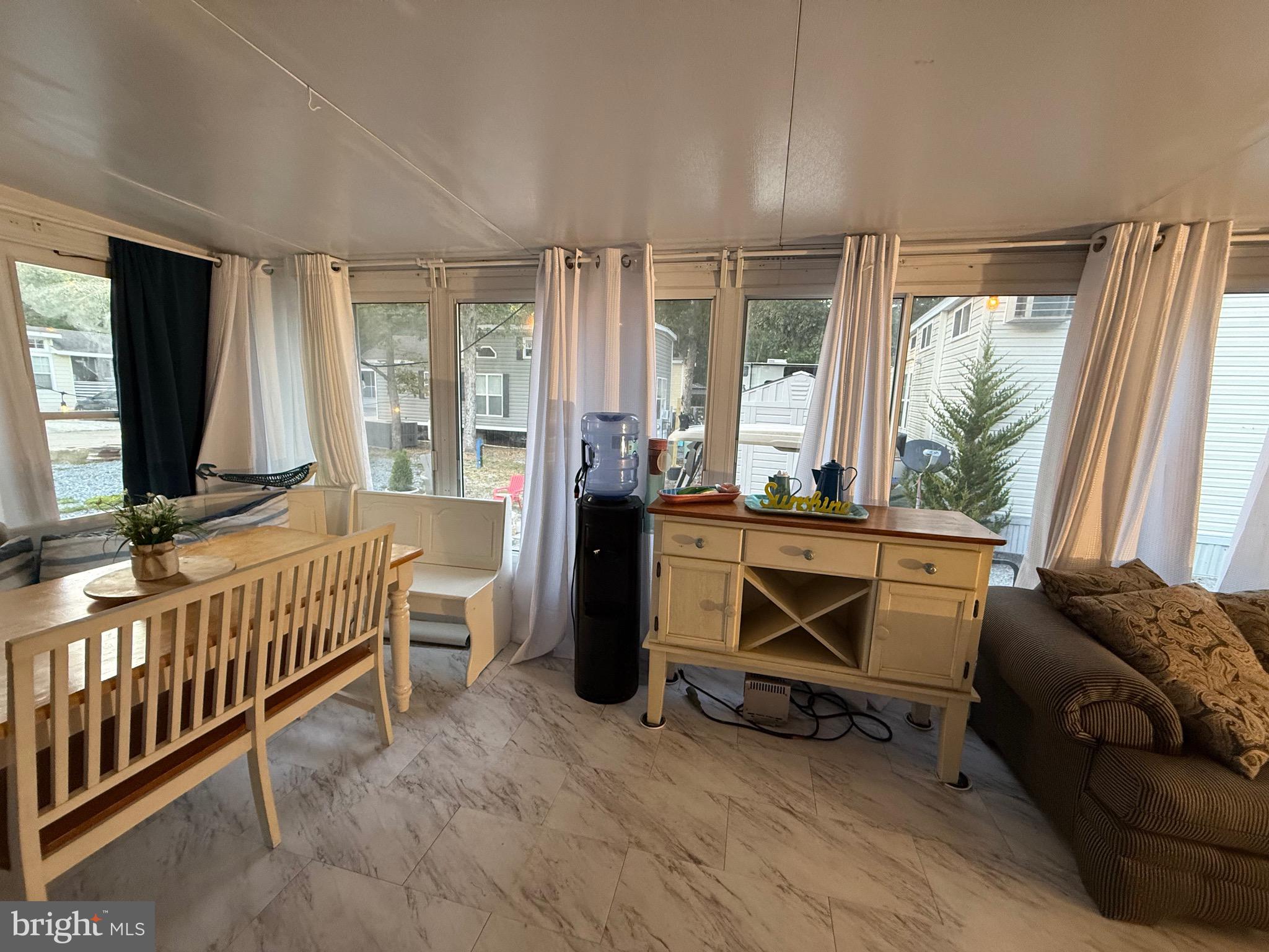 515 Corsons Tavern Road, Unit H61 Ocean View, NJ 08230 - Photo 2 of 19 a living room with baby crib furniture and a window