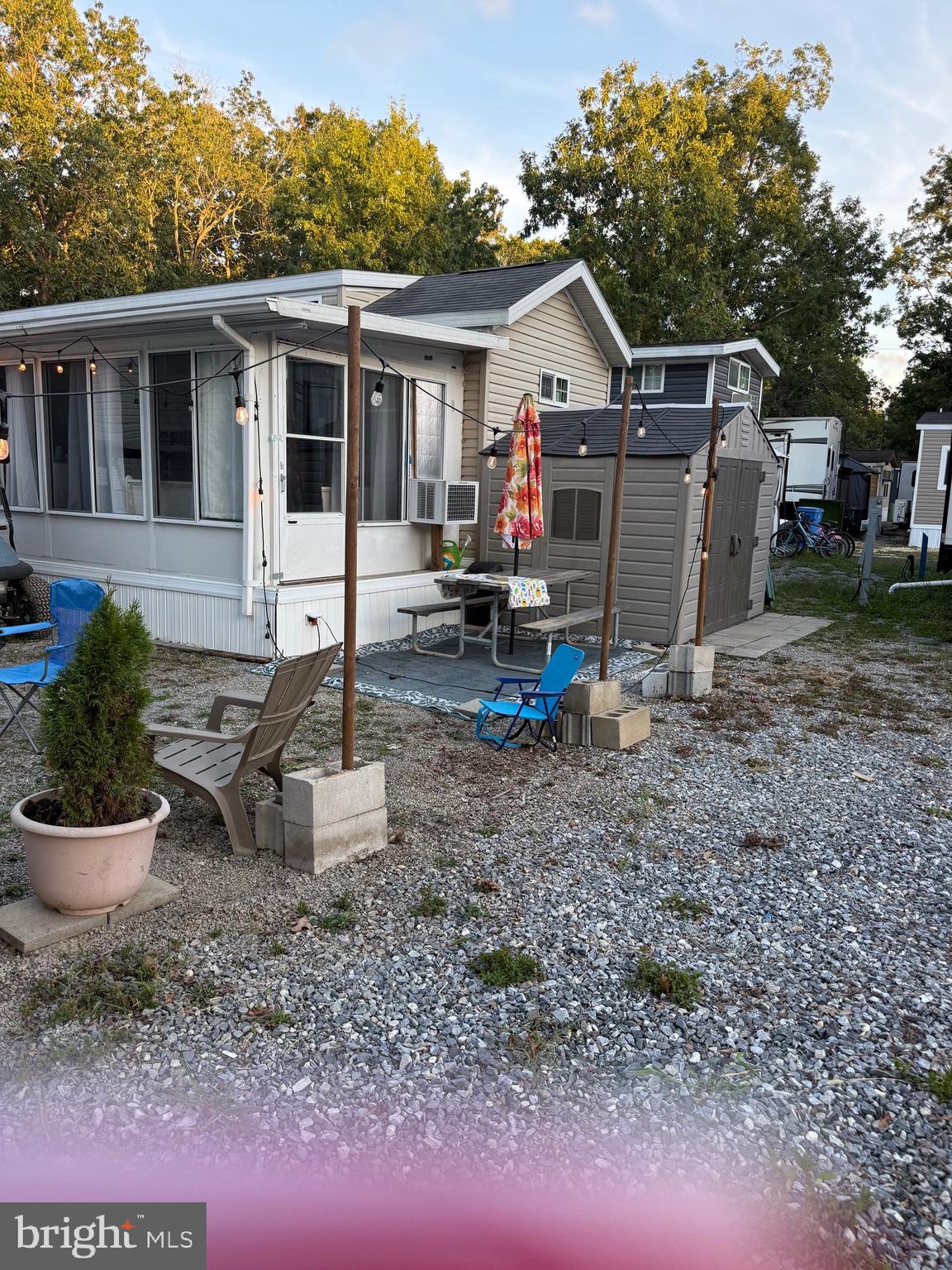 515 Corsons Tavern Road, Unit H61 Ocean View, NJ 08230 - Photo 5 of 19 a view of a house with a yard and sitting area
