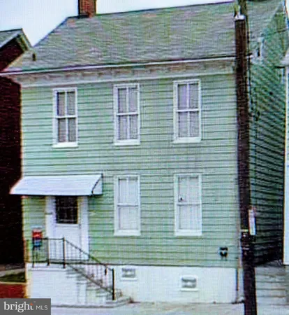a front view of a house with garage