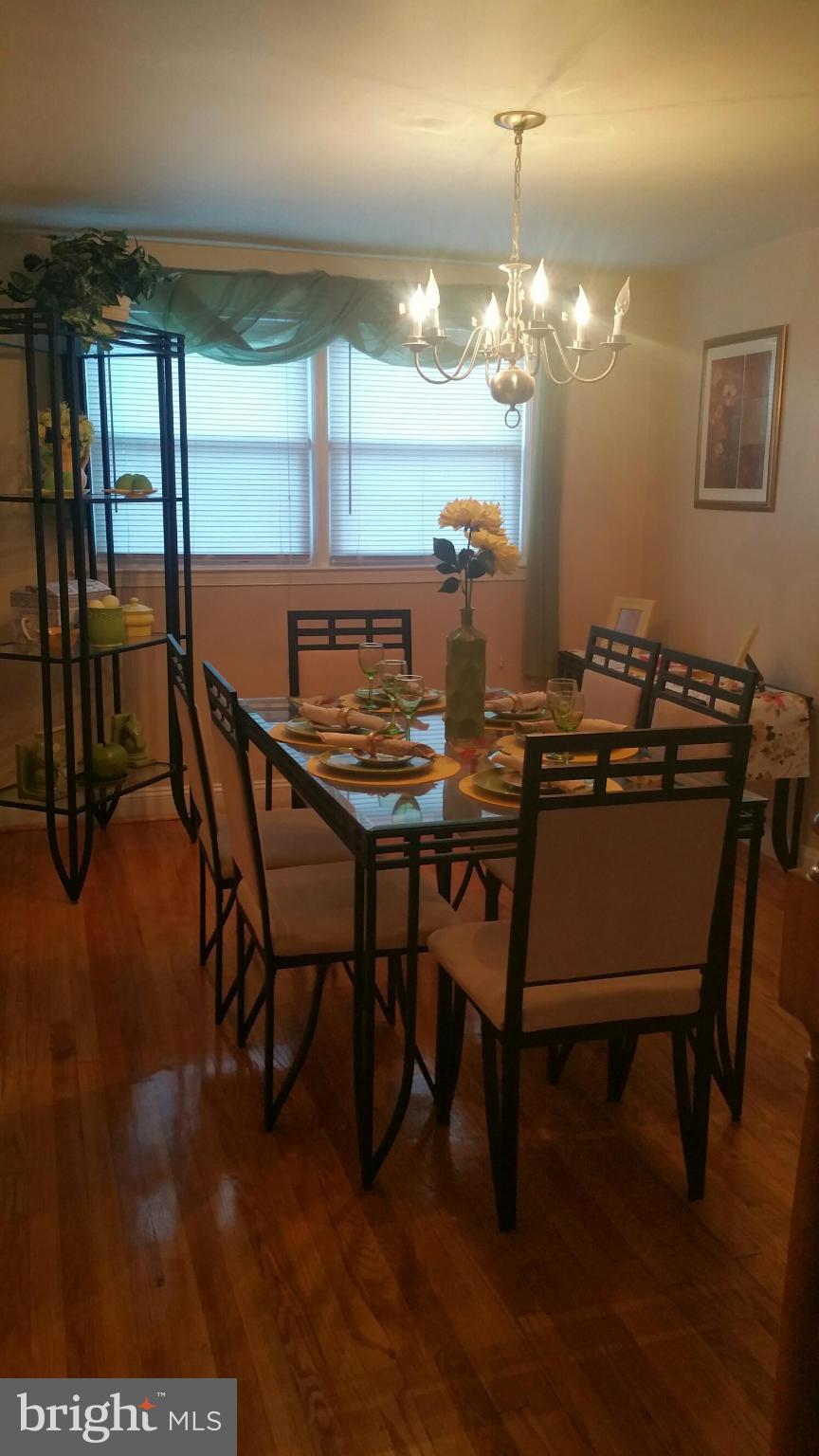 1528 Clairidge Road Baltimore, MD 21207 - Photo 5 of 14 a view of a dining room with furniture and window