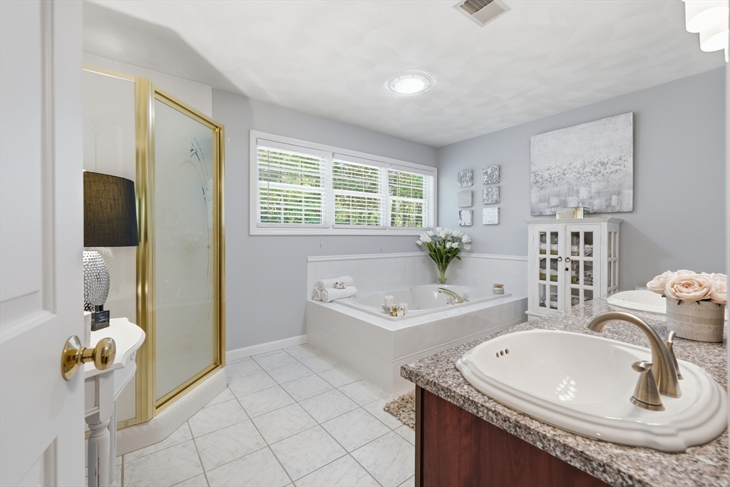 25 Haymeadow Road Boxford, MA 01921 - Photo 24 of 42 a bath room with a sink and a mirror