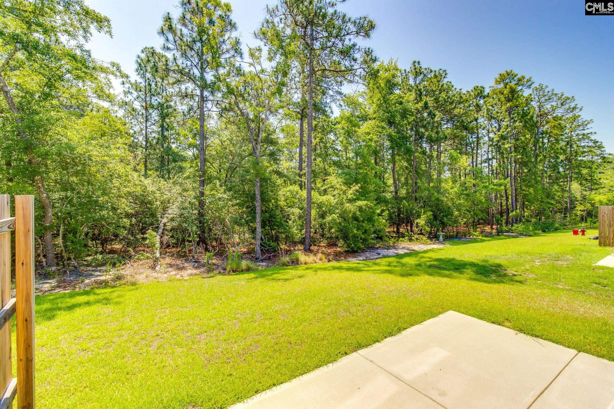 312 Reedmace Court Lexington, SC 29072 - Photo 28 of 29 a view of a swimming pool with an outdoor space and seating area