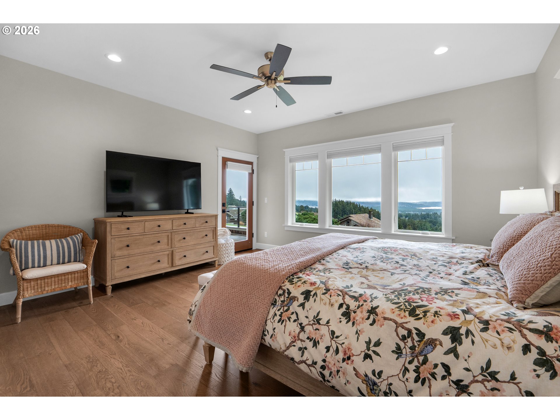 38590 Meadow Loop Nehalem, OR 97131 - Photo 27 of 48 a bedroom with a bed and a flat screen tv