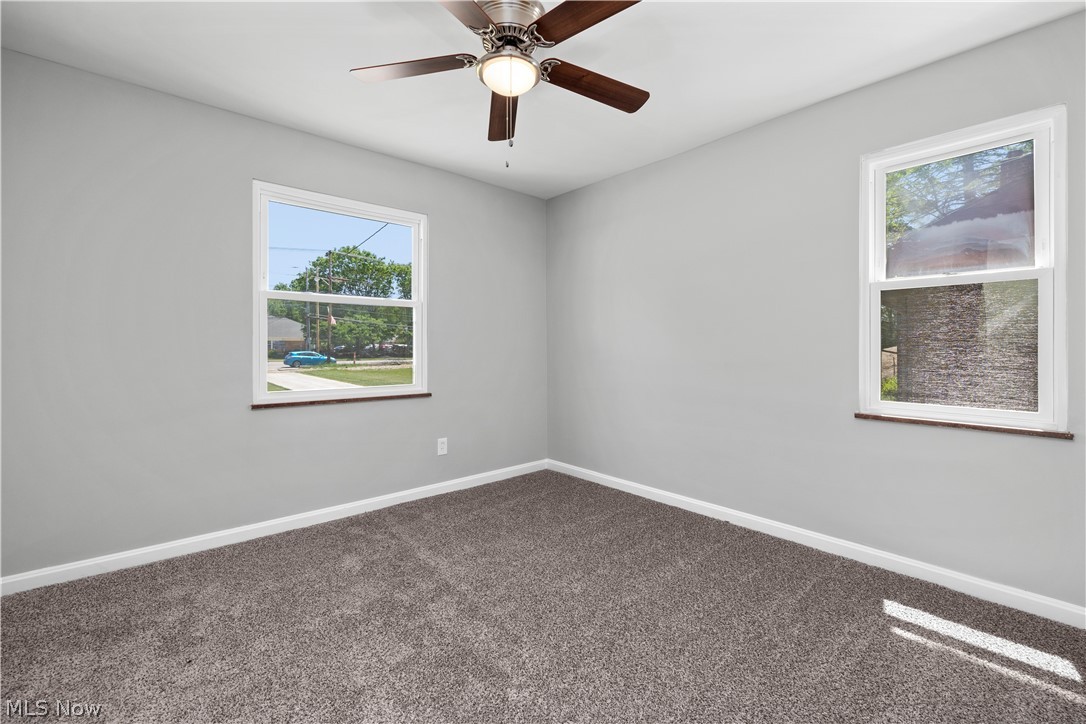 7030 Pearl Road Cleveland, OH 44130 - Photo 23 of 34 Carpeted spare room with ceiling fan
