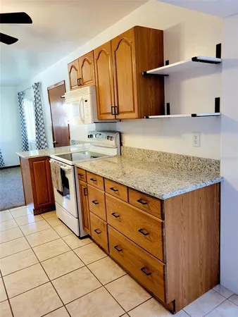 a kitchen with stainless steel appliances granite countertop a sink and cabinets