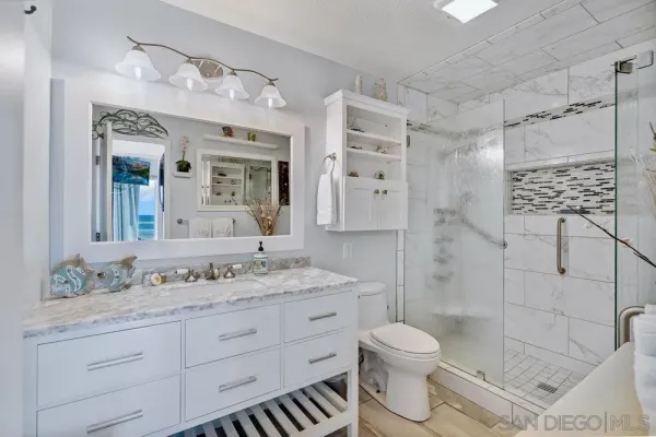 a view of a livingroom with wooden floor and a window