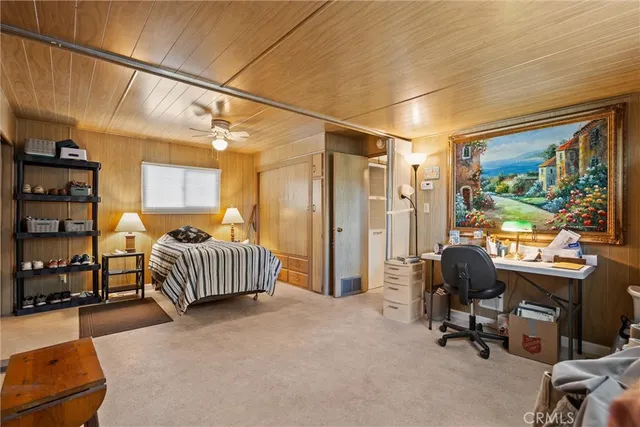 a bedroom with furniture and a window