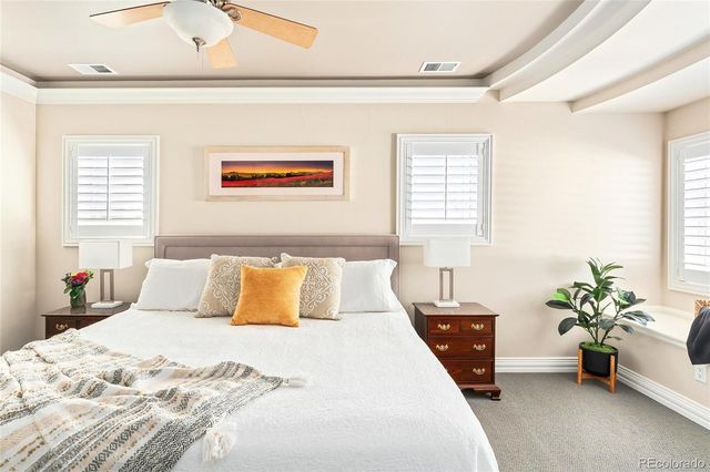 a bedroom with a bed and a couch