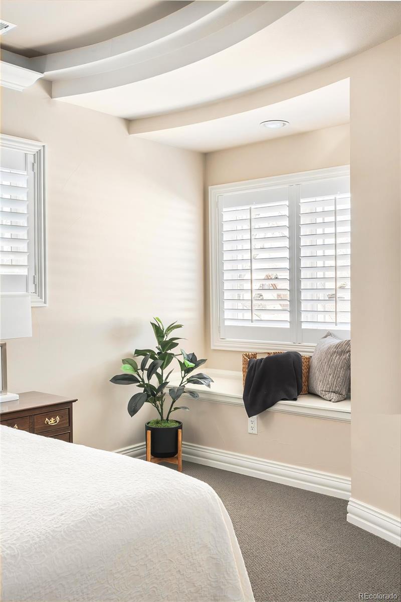 747 South Emerson Street Denver, CO 80209 - Photo 17 of 48 a bedroom with a bed and a couch