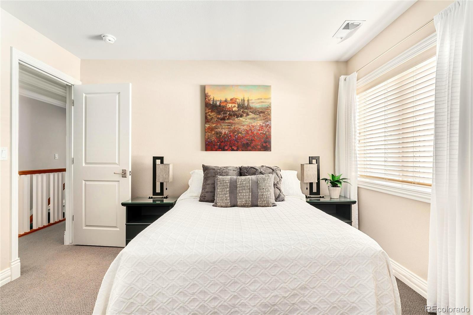 747 South Emerson Street Denver, CO 80209 - Photo 21 of 48 a bedroom with a large bed and a window