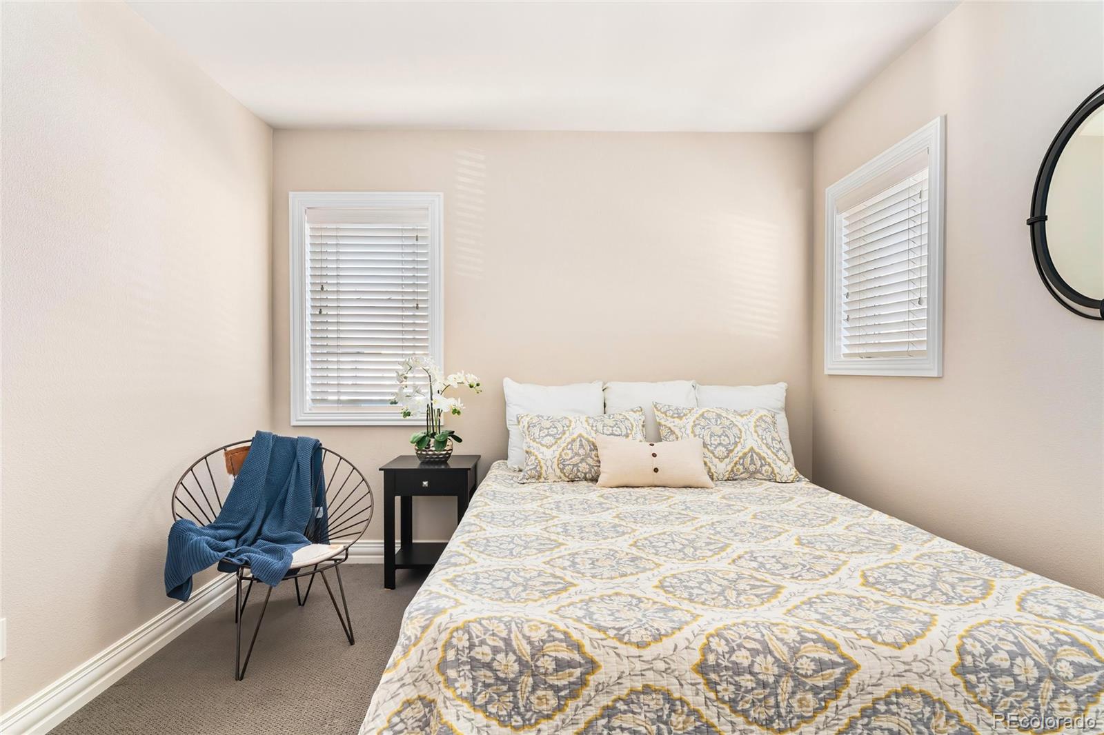 747 South Emerson Street Denver, CO 80209 - Photo 23 of 48 a bedroom with a bed chair and a window