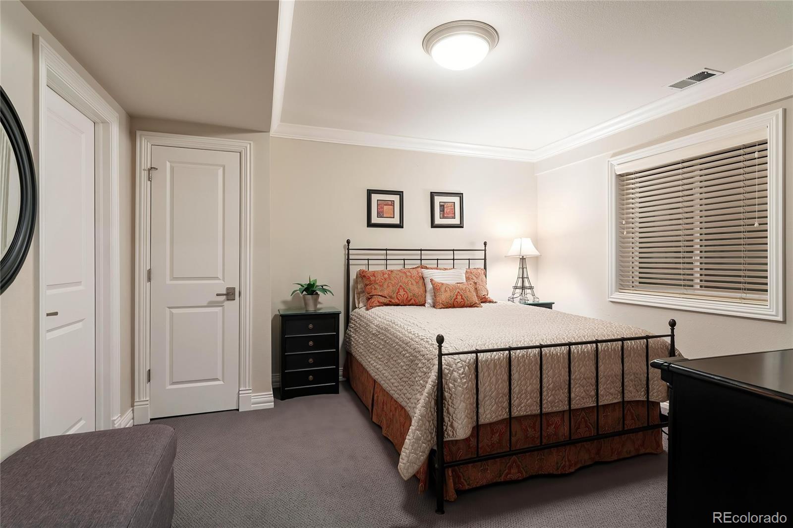 747 South Emerson Street Denver, CO 80209 - Photo 31 of 48 a bedroom with a bed and window