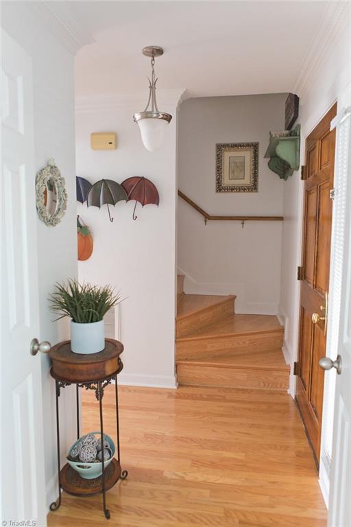 1507 Heathcliff Road High Point, NC 27262 - Photo 22 of 30 Hallway with Beautiful Hardwood Floors and Second Set of Stairs leading to the Bedrooms, Office & Laundry Upstairs. Extra Safety Wooden Tread on Steps to reduce Risk of Slipping.