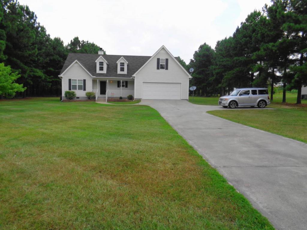 3121 Teamon Road Griffin, GA 30223 - Photo 1 of 1 a front view of a house with a yard and garage