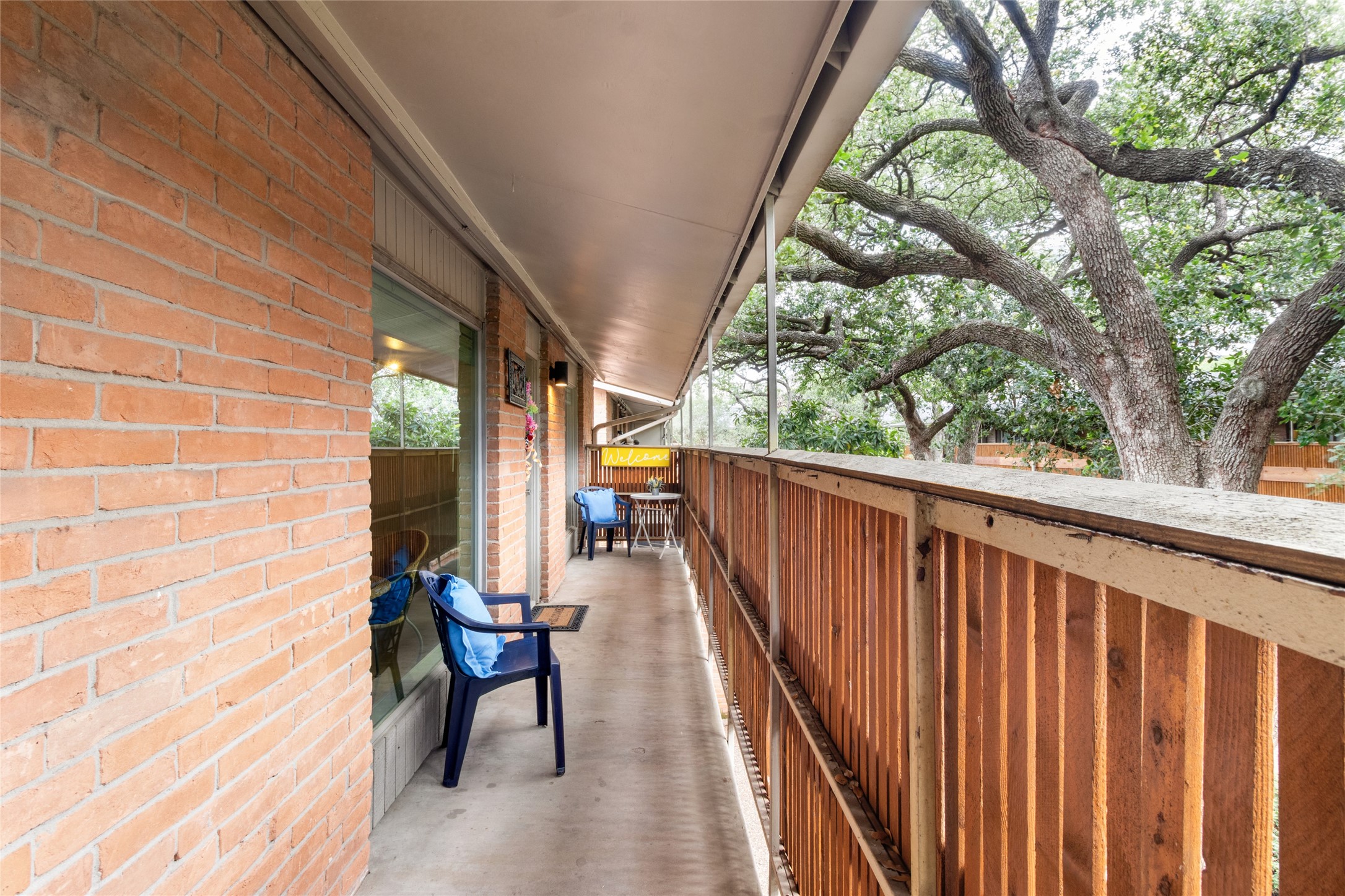 3924 West Alabama Street, Unit 4 Houston, TX 77027 - Photo 3 of 32 Beautiful long porch that overlooks the serene courtyard- it has power and ready for your festive lights!