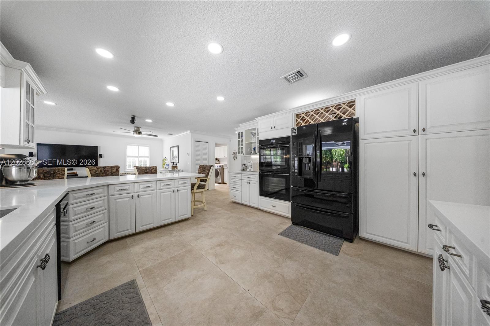 15351 Southwest 146th Street Miami, FL 33196 - Photo 18 of 86 Nicely detailed with Crown Mouldings and cabinet Accent Lighting.