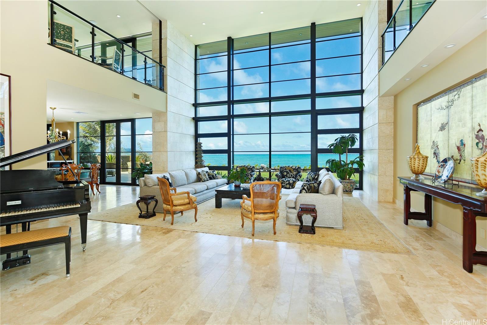 766 Mokulua Drive Kailua, HI 96734 - Photo 1 of 1 a living room with furniture and a flat screen tv
