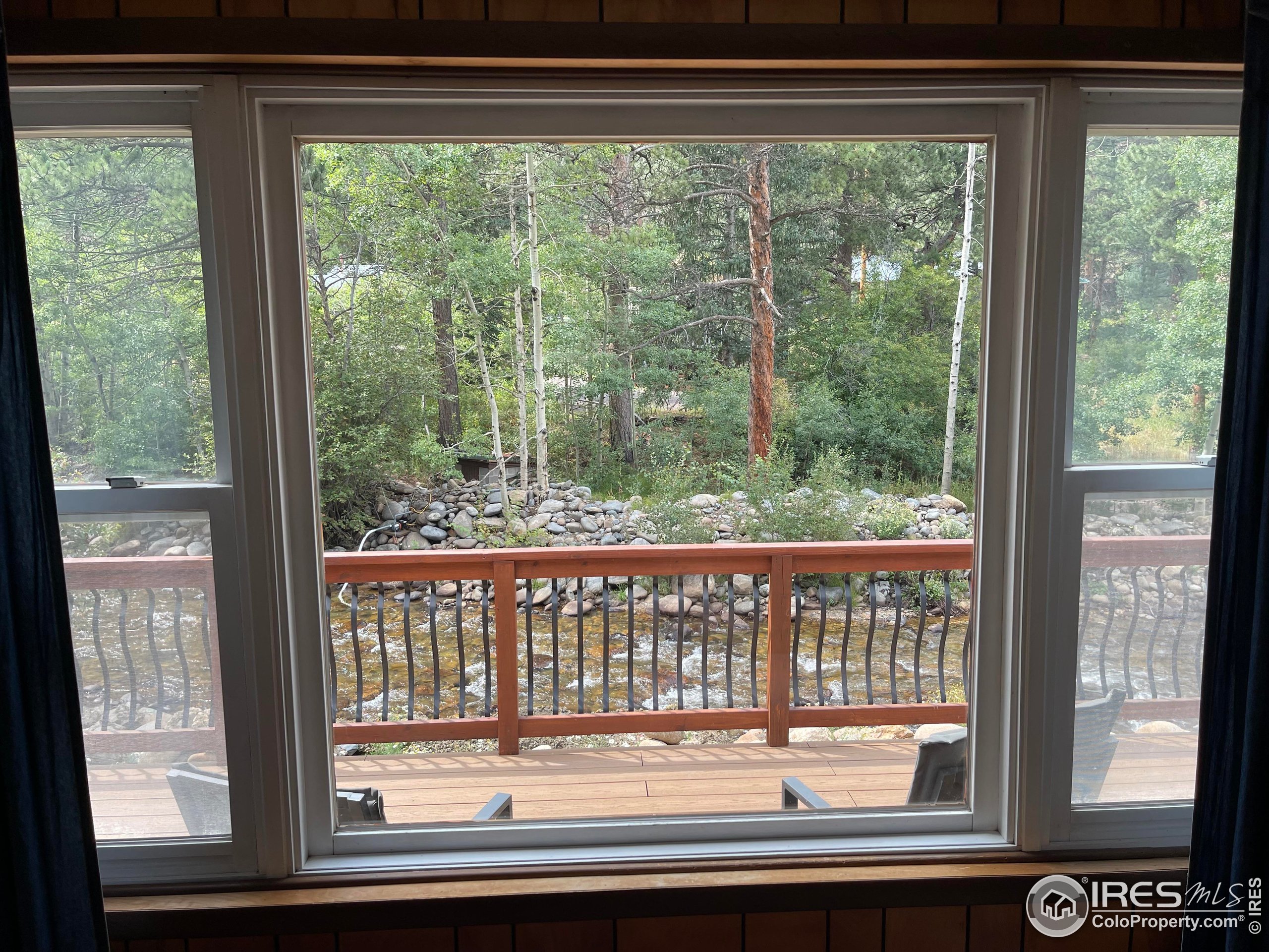 664 Riverside Drive Lyons, CO 80540 - Photo 12 of 16 a view of a window and a porch