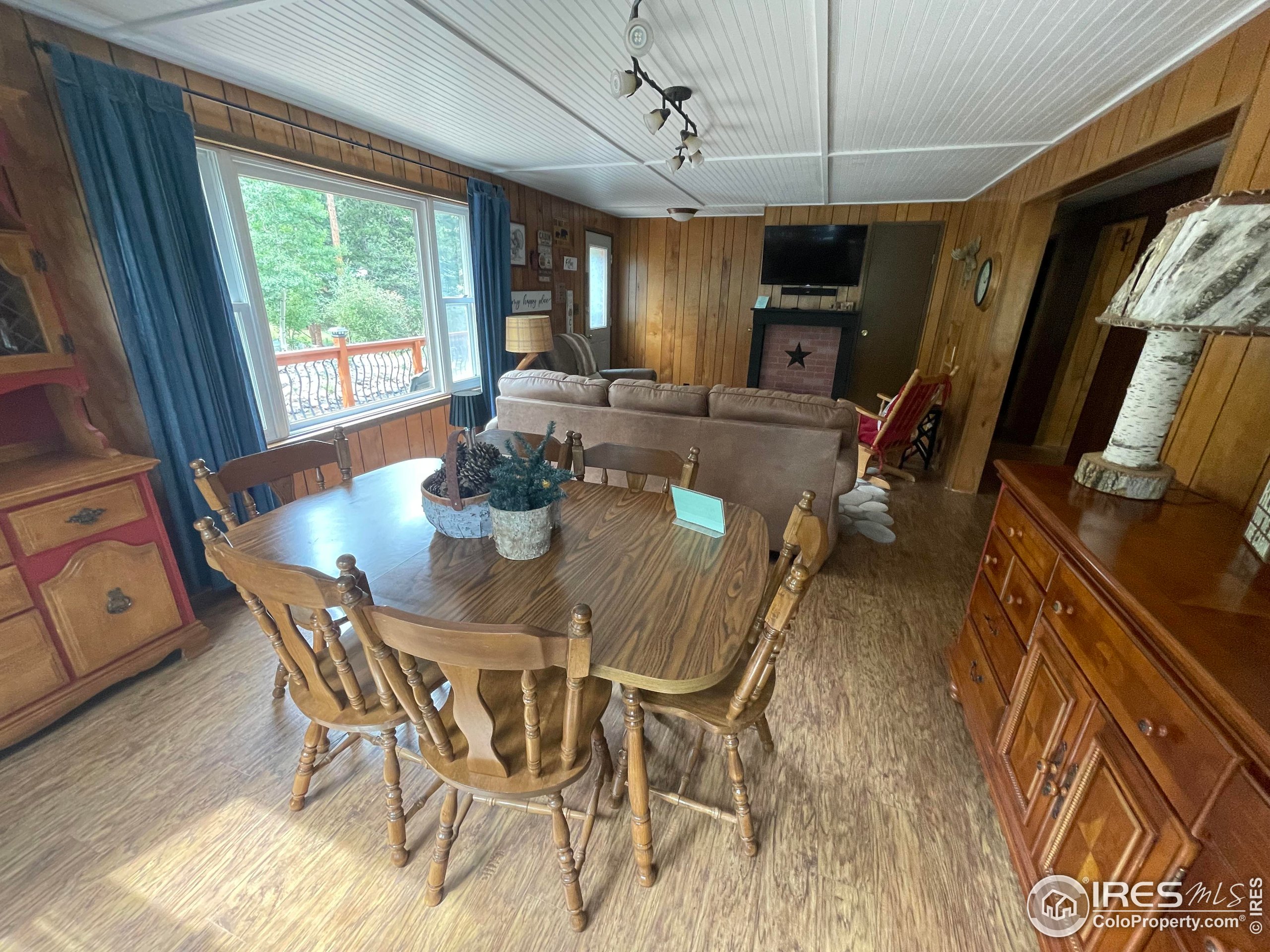 664 Riverside Drive Lyons, CO 80540 - Photo 6 of 16 a view of a dining room with furniture window and outside view