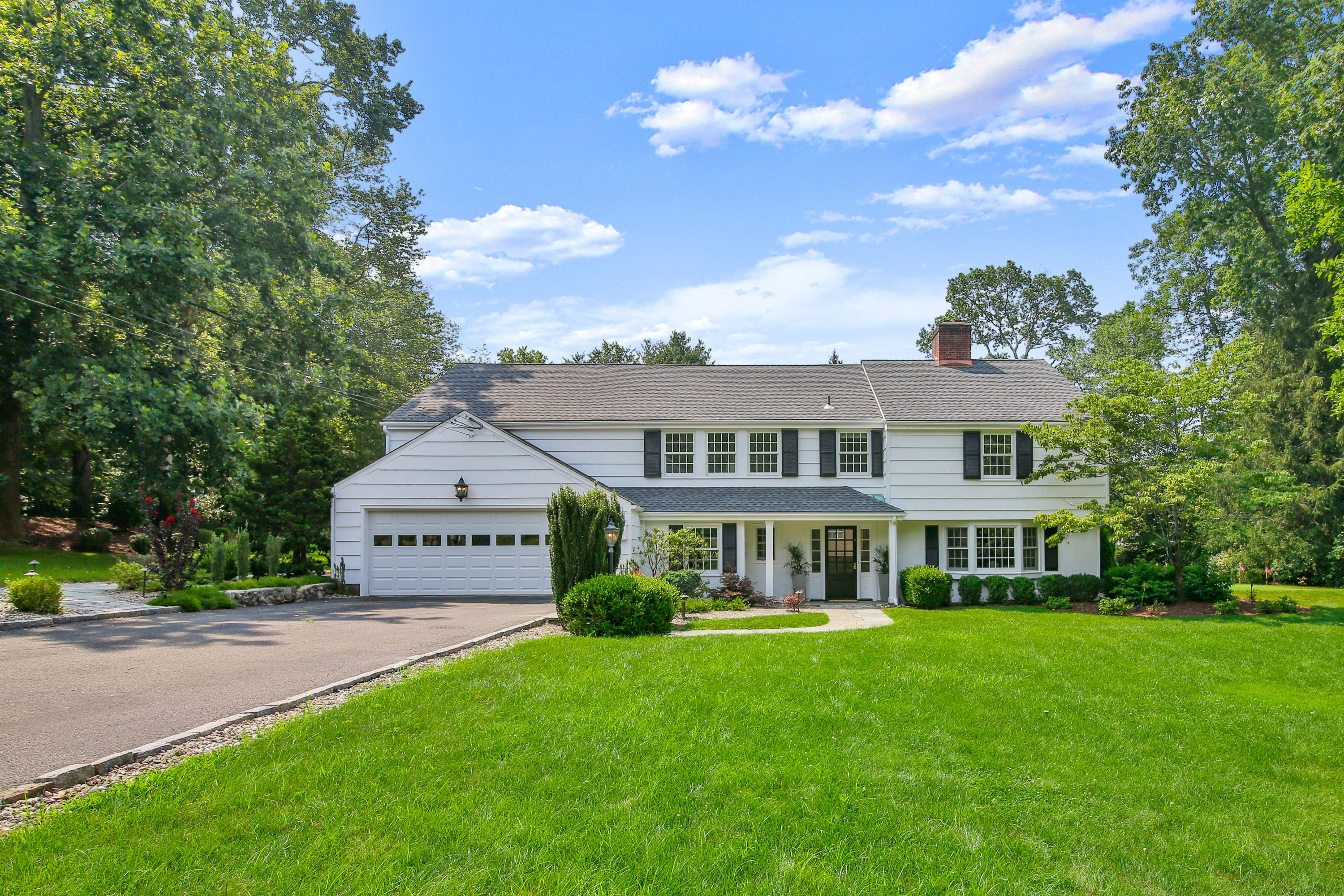 114 Colony Road Darien, CT 06820 - Photo 1 of 40 a front view of a house with a yard