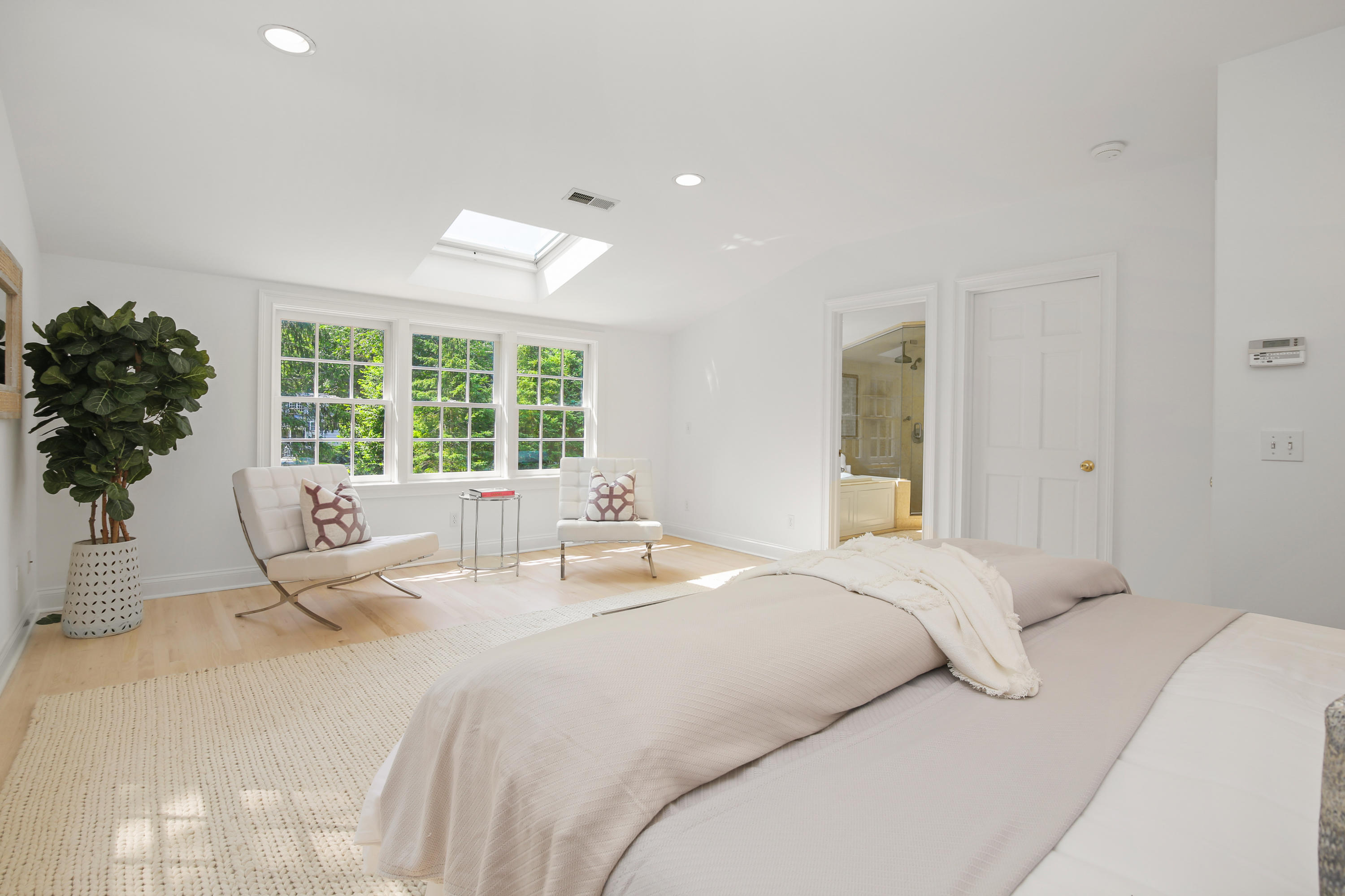 114 Colony Road Darien, CT 06820 - Photo 18 of 40 a bedroom with a large bed and a large window