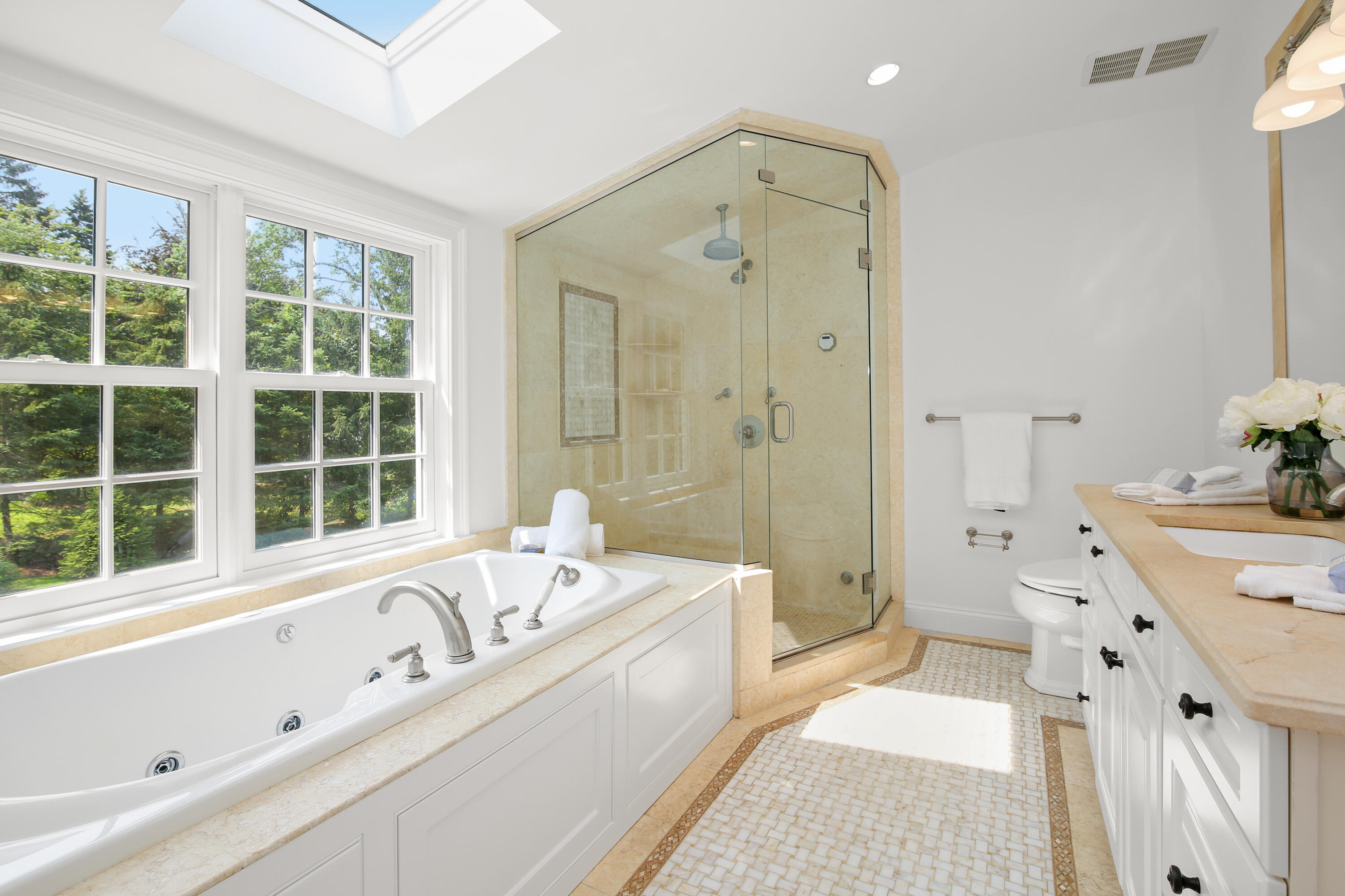 114 Colony Road Darien, CT 06820 - Photo 20 of 40 a spacious bathroom with a tub sink and mirror
